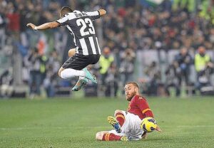 AS Roma's Daniele De Rossi challenges Juventus' Arturo Vidal during their Italian Serie A soccer match in Rome