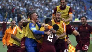 AS Roma's Yanga-Mbiwa celebrates with his team mates after scoring against Lazio during their Serie A soccer match at the Olympic stadium in Rome