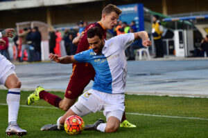 Roma's defender from England Lucas Digne (back) fights for the ball with Chievo's midfielder from Serbia Ivan Radovanovic during the Italian Serie A football match Chievo Verona vs AS Roma on January 6, 2016 at Bentegodi Stadium in Verona. AFP PHOTO / GIUSEPPE CACACE / AFP / GIUSEPPE CACACE (Photo credit should read GIUSEPPE CACACE/AFP/Getty Images)