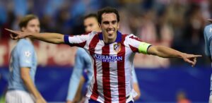 Atletico Madrid's Uruguayan defender Diego Godin celebrates after scoring their fourth goal during the UEFA Champions League football match Club Atletico de Madrid vs Malmo FF at the Vicente Calderon stadium in Madrid on October 22, 2014. AFP PHOTO/ JAVIER SORIANO (Photo credit should read JAVIER SORIANO/AFP/Getty Images)