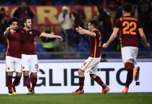 Roma's Italian forward Stephan El Shaarawy (R) celebrates with teammates after scoring a goal during the Italian Serie A football match AS Roma vs ACF Fiorentina at the Olympic Stadium in Rome on March 4, 2016. / AFP / FILIPPO MONTEFORTE (Photo credit should read FILIPPO MONTEFORTE/AFP/Getty Images)