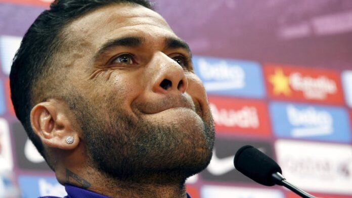 Barcelona's Dani Alves gestures during e a news conference after a training session at the Barcelona training grounds Ciutat Esportiva Joan Gamper in Sant Joan Despi near Barcelona
